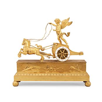 1672. A French Empire early 18th century gilt bronze mantel clock.