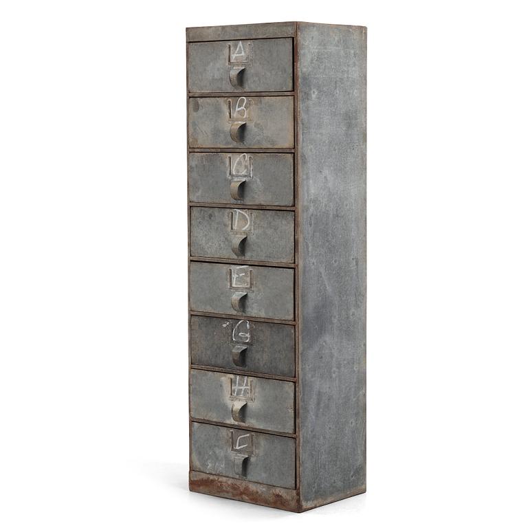 A contemporary metal chest of drawers.