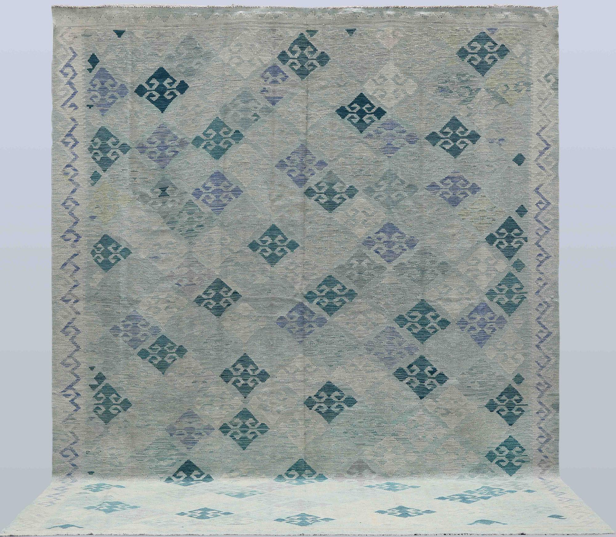 A Kilim carpet, c. 392 x 294 cm.