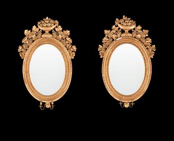 722. A pair of Swedish Empire 19th century two-light girandole mirrors.