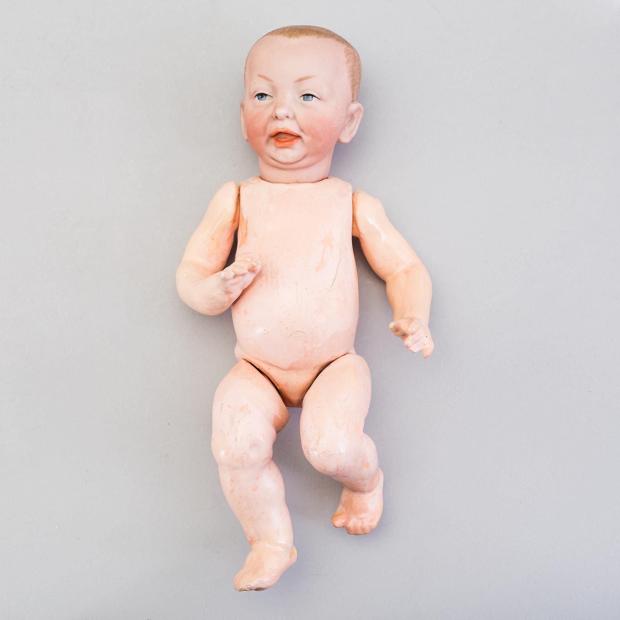 A bisque head character baby doll nr 100 by Kämmer & Reinhardt, Germany, 1910-tal.