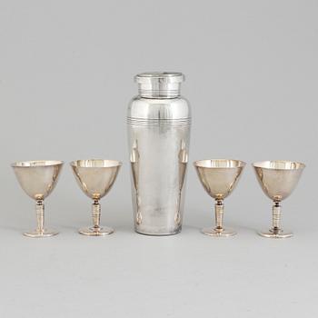 A mid 20th century silver plated shaker and four glasses.