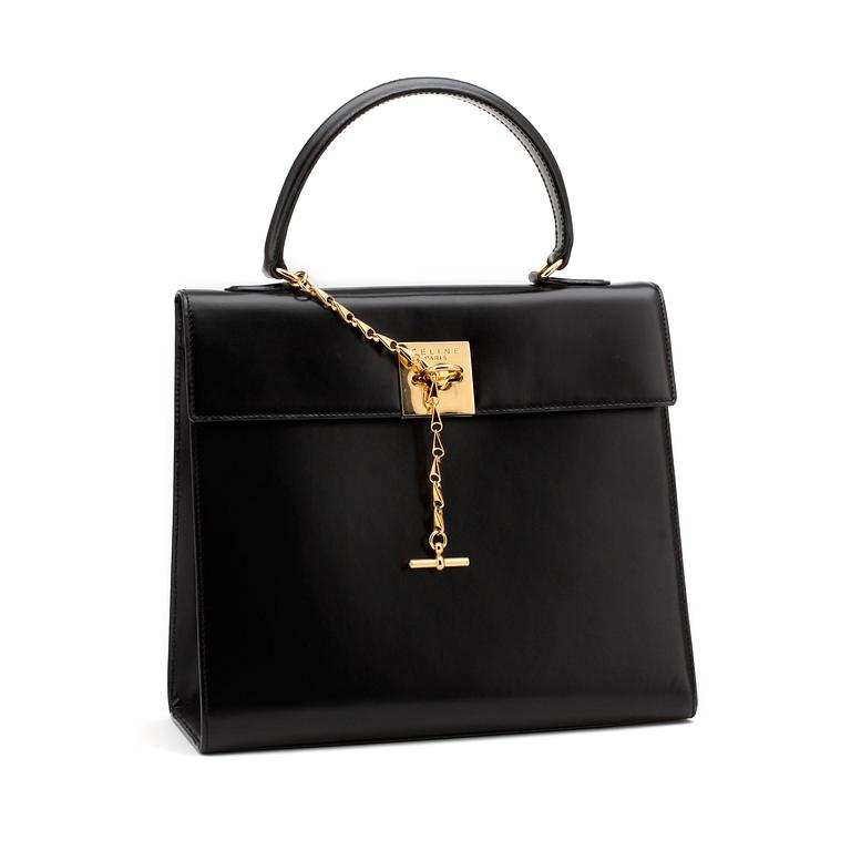 CÉLINE, a black leather top handle purse.