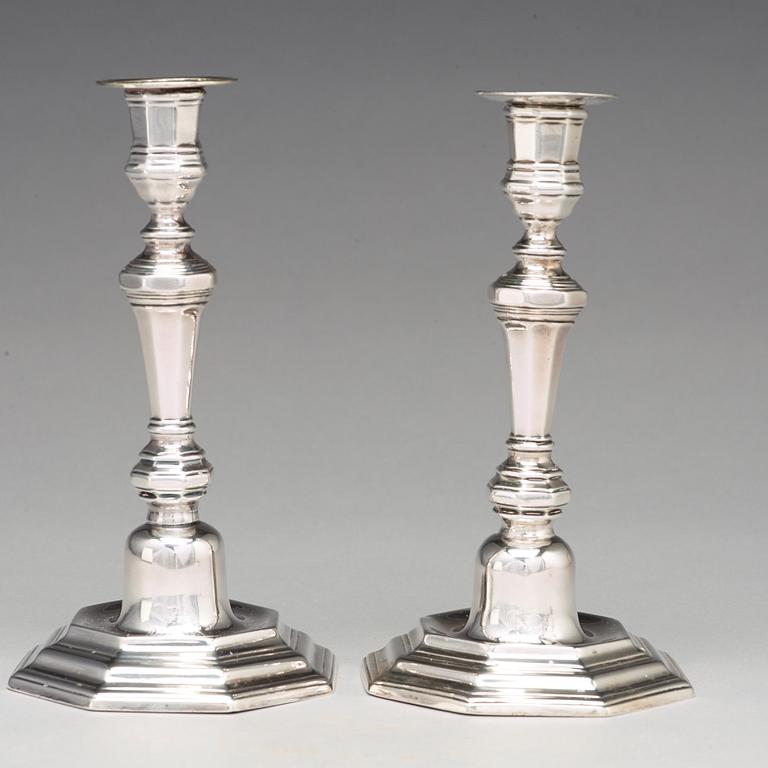 A pair of European 18th century silver candlesticks, unidentified makers mark.