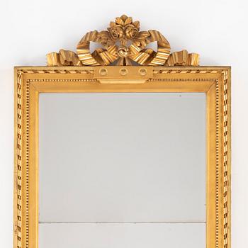 A giltwood and parcel-gilt gustavian mirror by J. Åkerblad (Master in Stockholm 1758-1799).