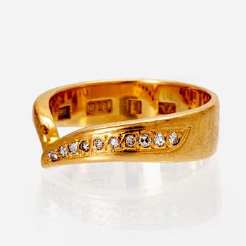 An 18K gold ring with octagonal cut diamonds.