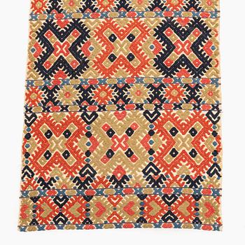 A bench cushion, flat weave, c. 344 x 51 cm, Herrestads district, Scania, Sweden, first half of the 19th century.