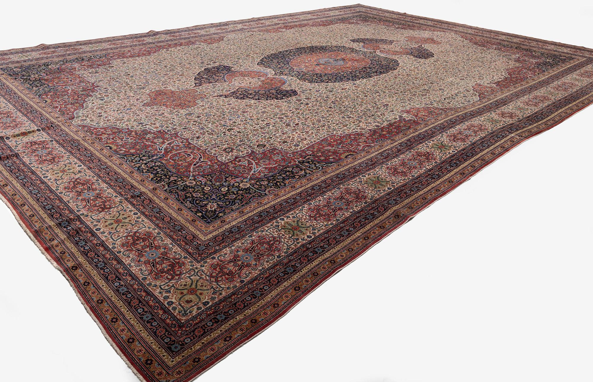 A semi-antique Hereke carpet, Western Turkey, c. 685 x 489 cm.