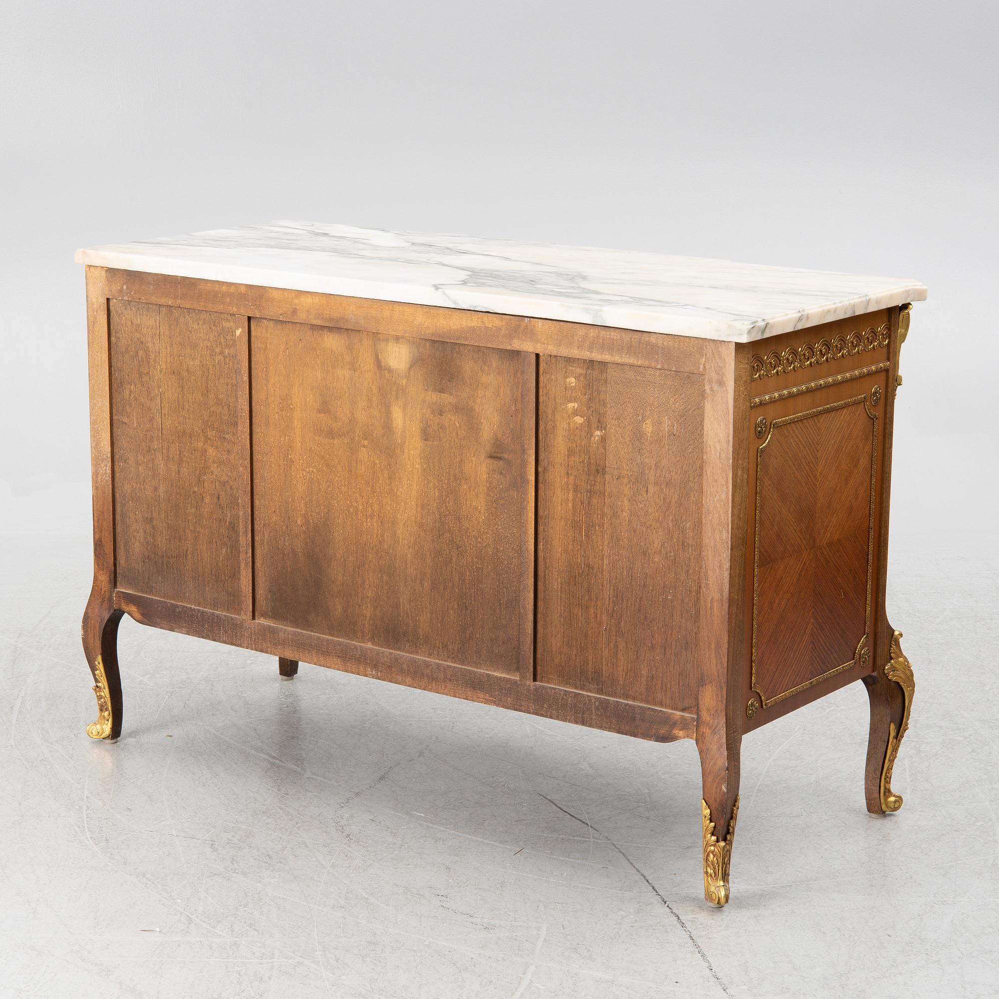 A chest of drawers, Louis XVI style, mid 20th Century.