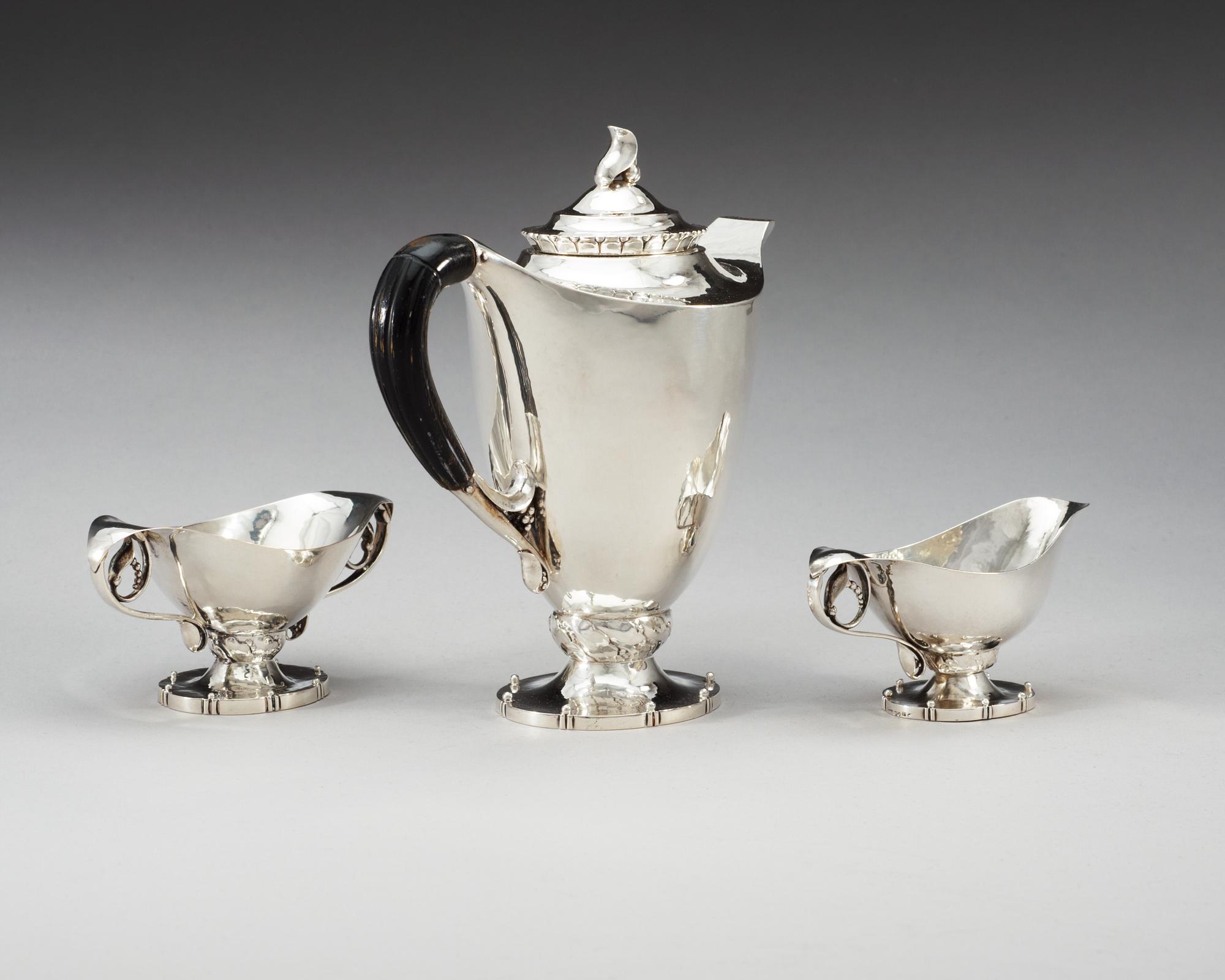 A Georg Jensen three pieces of 830/1000 silver coffee service, Copenhagen 1919-20.