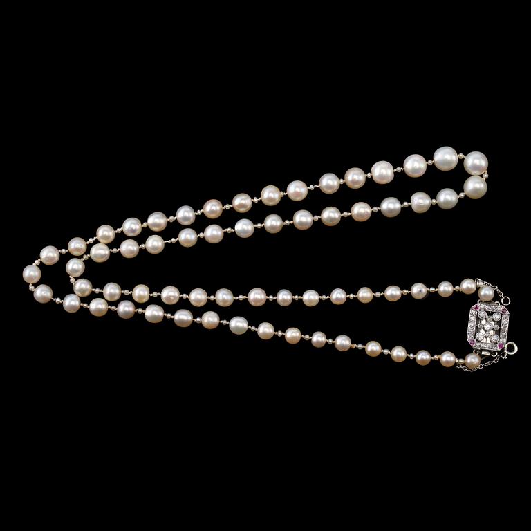 A NECKLACE, cultivated sea water pearls 2-8 mm. Old cut diamonds c. 0.60 ct. rubies. Clasp 18K gold.