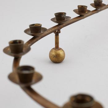 A mid 20th Century brass candle ring.