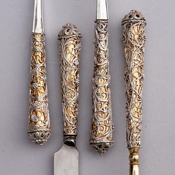 A Swedish parcel-gilt silver and filigree four-piece travel cutlery set, marks of Gustaf Otto Sjöberg, Falun 1813.