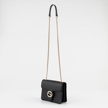 Gucci, a black leather 'Interlocking G' bag.