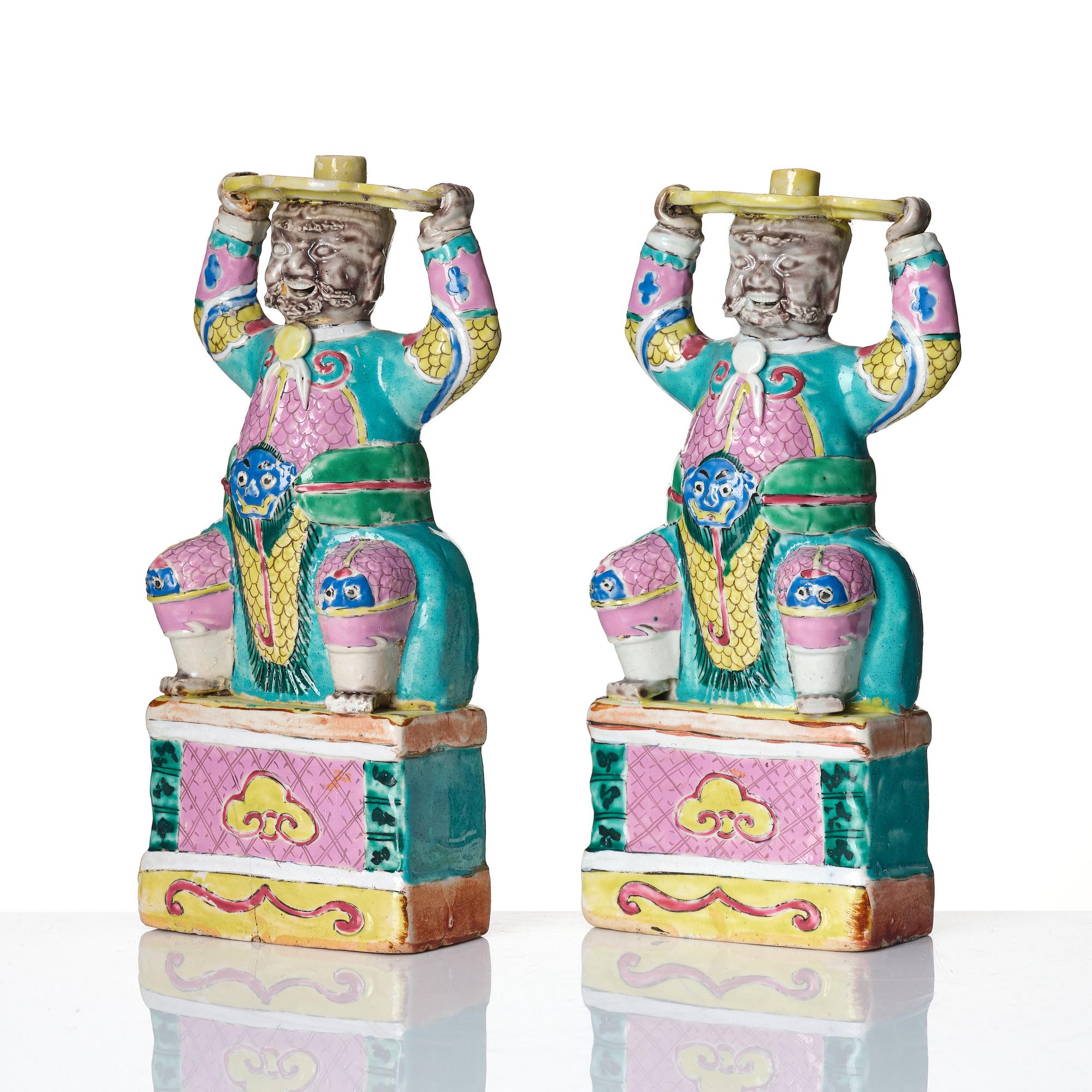 A pair of famille rose candlesticks, Qing dynasty, Qianlong (1736-95).