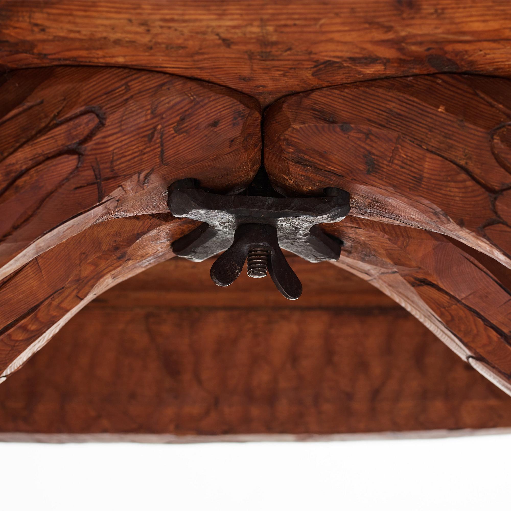 Gustaf Fjaestad, an Art Nouveau carved pine table, Arvika Sweden 1914, a double to the table in the Thiel Collection,