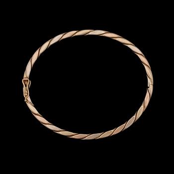 ARMRING, 14k trefärgat guld. Vikt 20,5g.