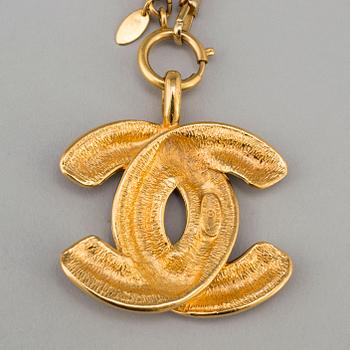 CHANEL, a metal necklace/belt.