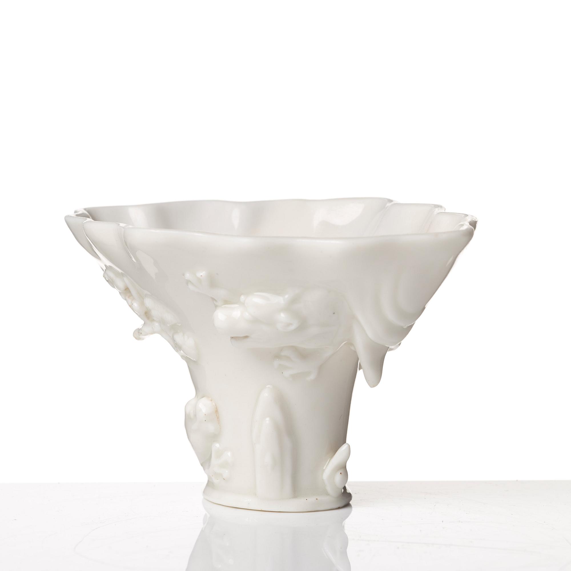 A blanc de chine rhinoserous libation cup, Qing dynasty, Kangxi (1662-1722).