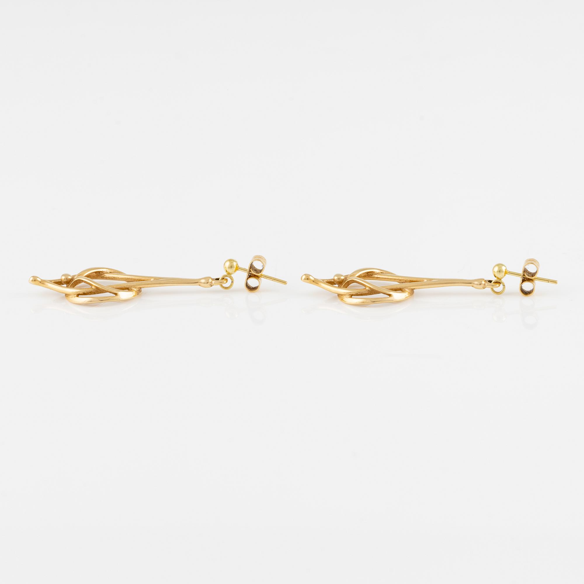 A pair of 18K gold earrings.