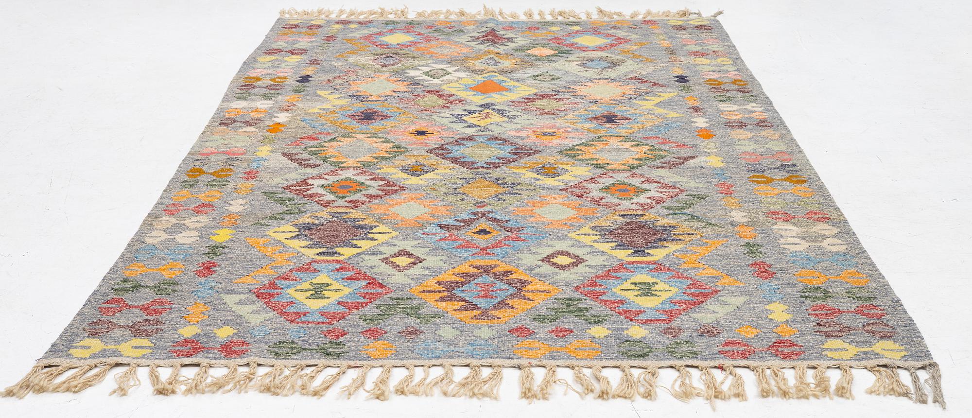 A Kelim carpet, c. 309 x 180 cm.