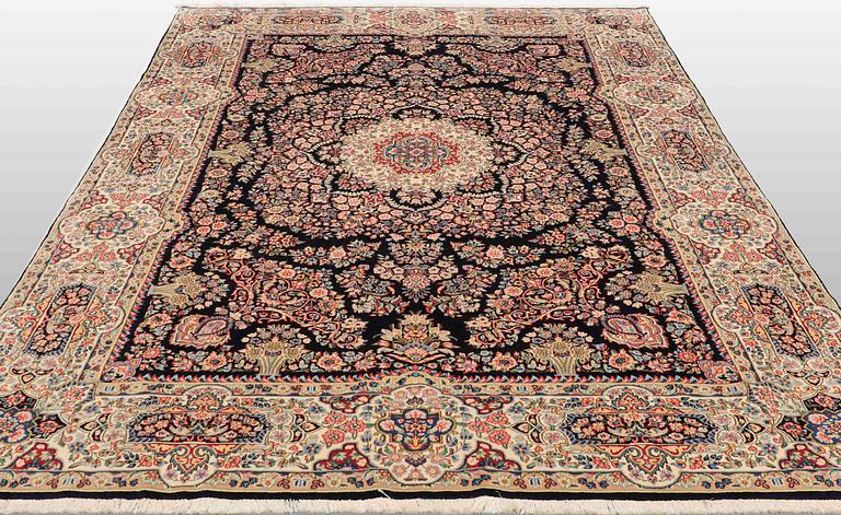 A Kirman Laver carpet, 'Millefleur', approx. 325 x 235 cm.