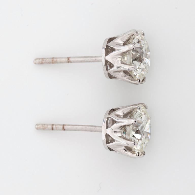 A pair of diamond solitaire, 2.01 cts and 2.04 cts, earrings. Quality circa L/VS2.