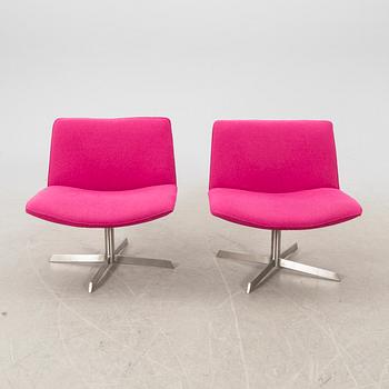 A pair of Corvette Fine Design easy chairs 21st century.