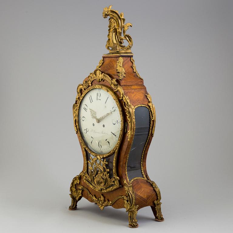 A Rococo/Rococo-style 18th/19th century mantel clock.