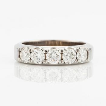 Ring with five brilliant-cut diamonds.