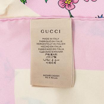 Gucci, a 'Flora' silk scarf.