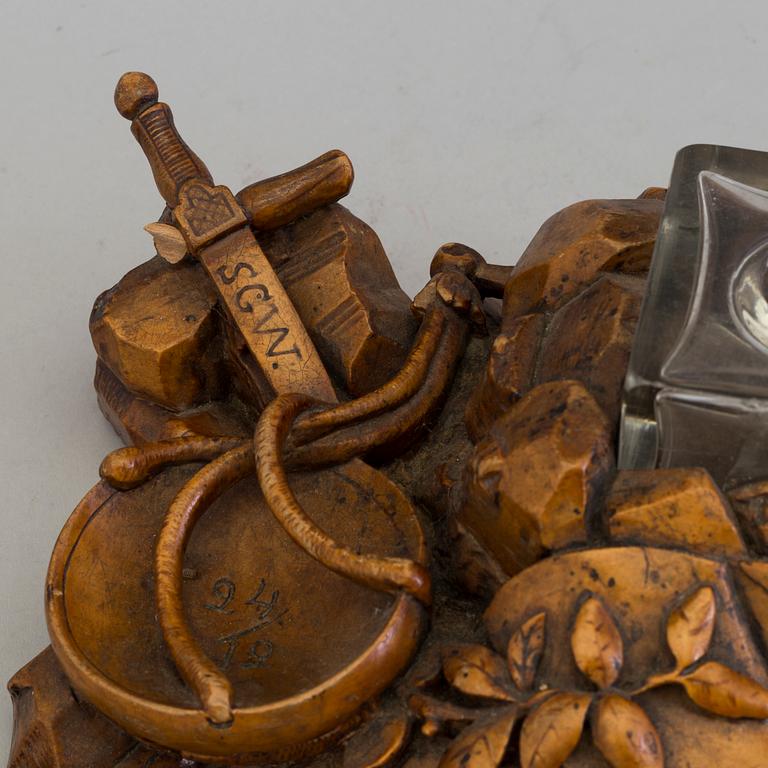 A CARVED WOOD INK STAND, dated 1859.