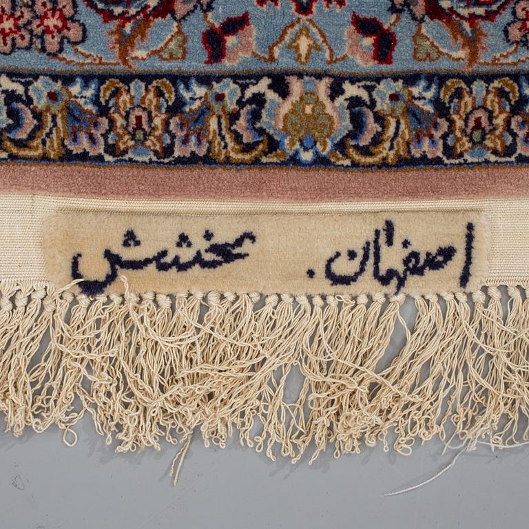 A rug from Esfahan, signed, around 160 x 103 cm.