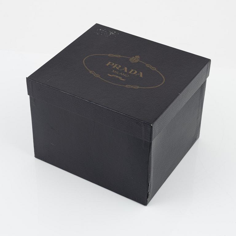 Prada, a satin bag.