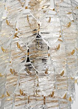 GUNNAR CYRÉN, a glass and gilt bronze chandelier, Orrefors, Sweden 1960's.