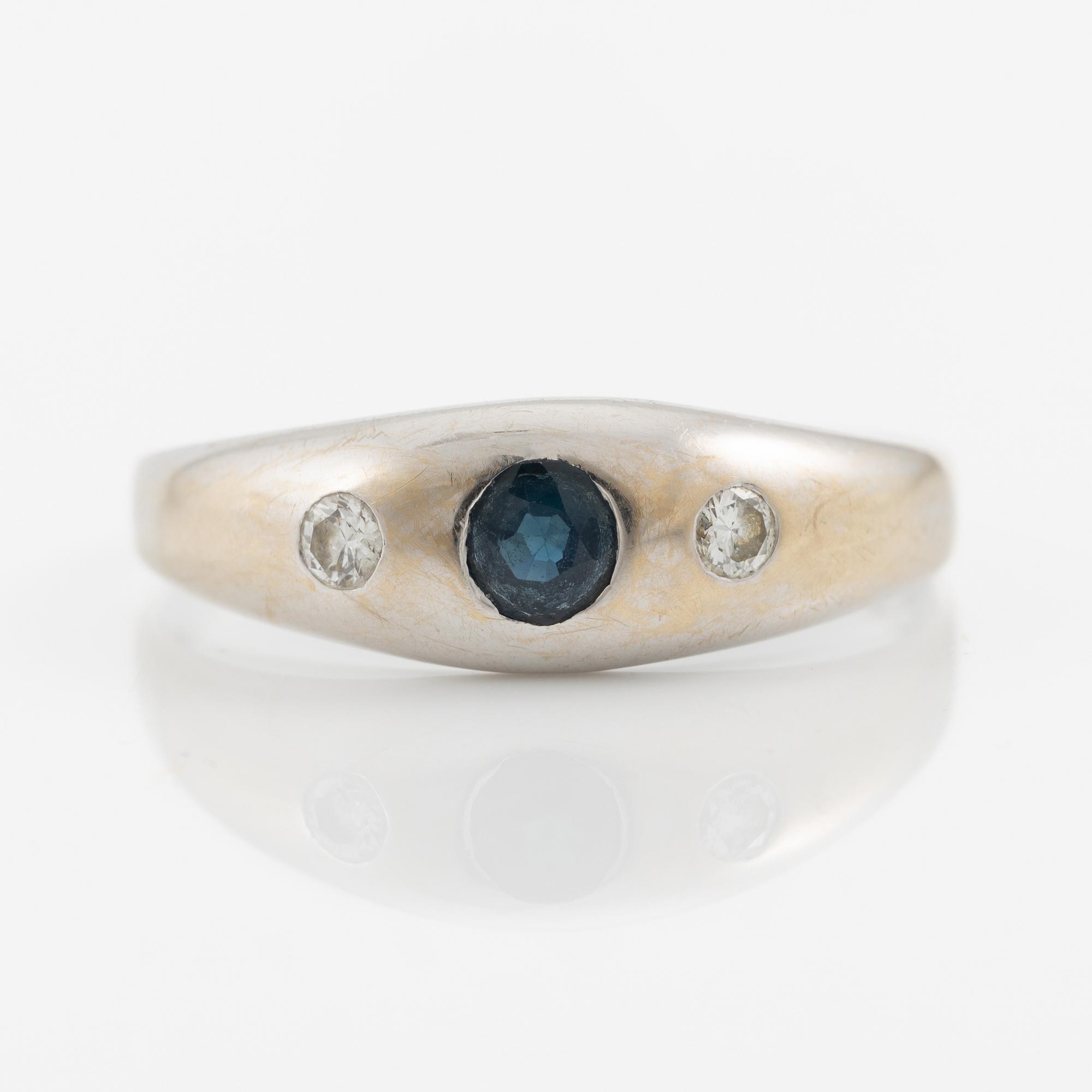 Ring, 18K white gold with sapphire and brilliant-cut diamonds.