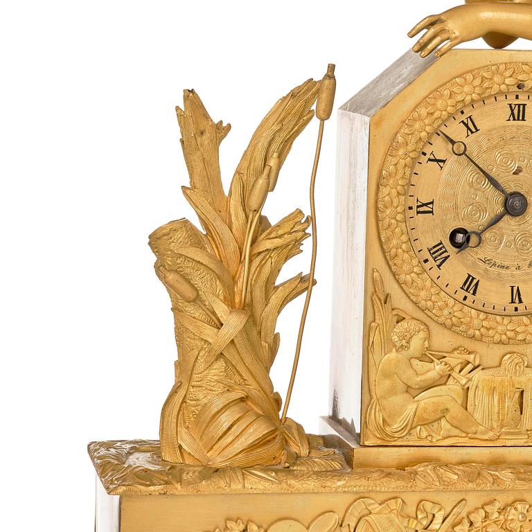 A French Empire ormolu and patinated bronze mantel clock, Paris, early 19th century.