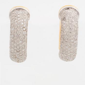 Gold and brilliant-cut diamond hoop earrings.