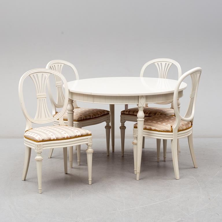 Four chairs with dinner table, late 20th Century.