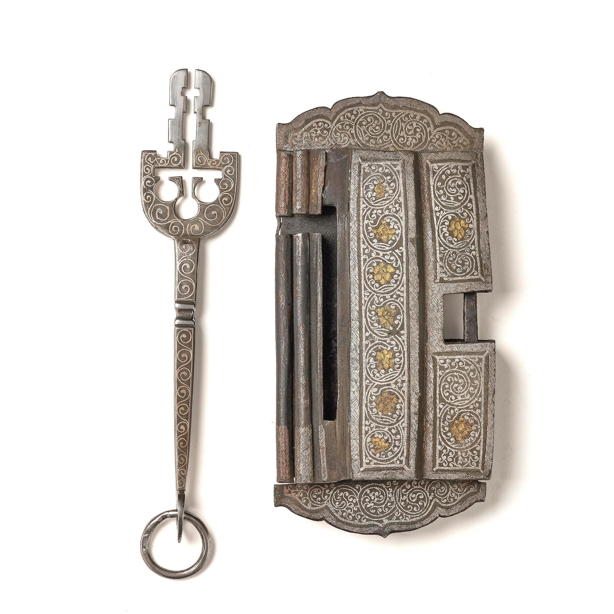 A Shokpa-shaped lock, inlaid with silver threads, Tibet, 19th century. 'Ashtamangala'.