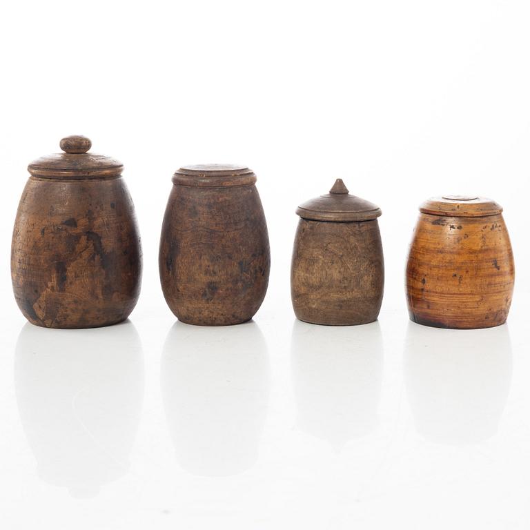 A set of four turned folk art jars, 19th century.