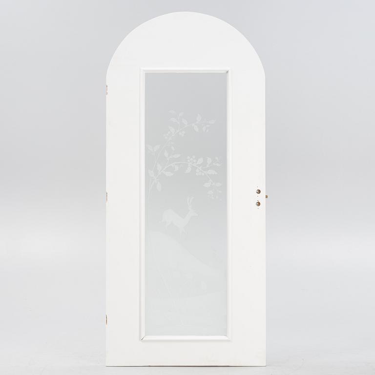Glössner & Co, a signed glass door.