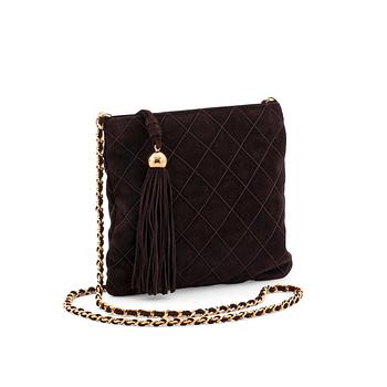552. CHANEL, a brown suede cross body bag.