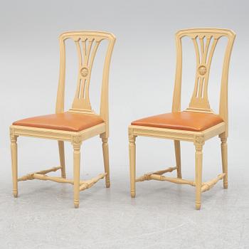 A Gustavian style dining table with six dining chairs, Sweden, 21st century.