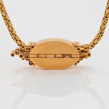 Hängsmycke 18K guld med en opal och runda briljantslipade diamanter.