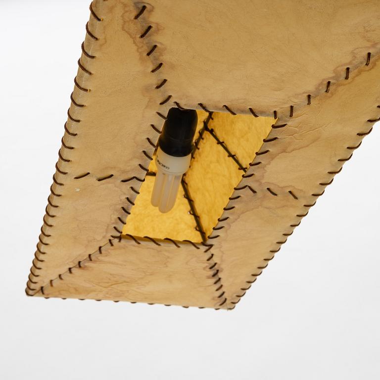 A chalet style mid century modern ceiling lamp.