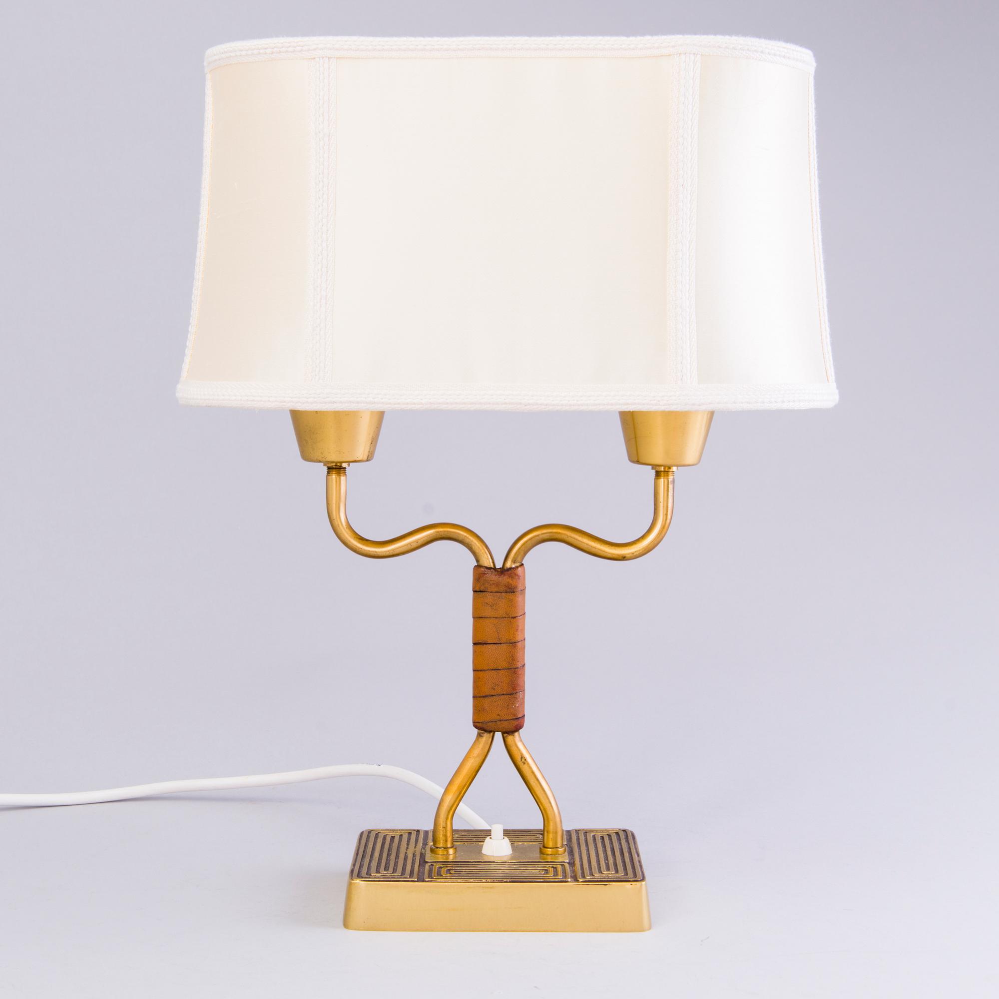 SONJA KATZIN, A 1940s brass table light from Asea, Sweden.