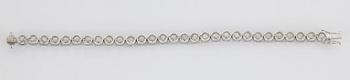 An 18K white gold bracelet set with round brilliant-cut diamonds with a total weight of ca 12.00 cts.