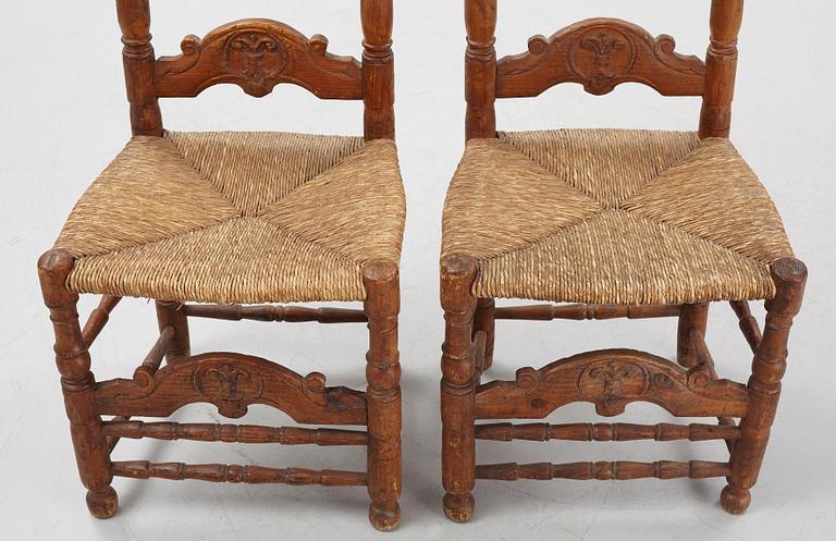 A pair of Spanish colonial style ladder-back chairs, circa 1900.