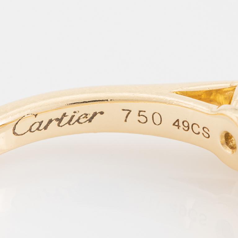 Cartier 18K gold and brilliant cut diamond solitaire ring.